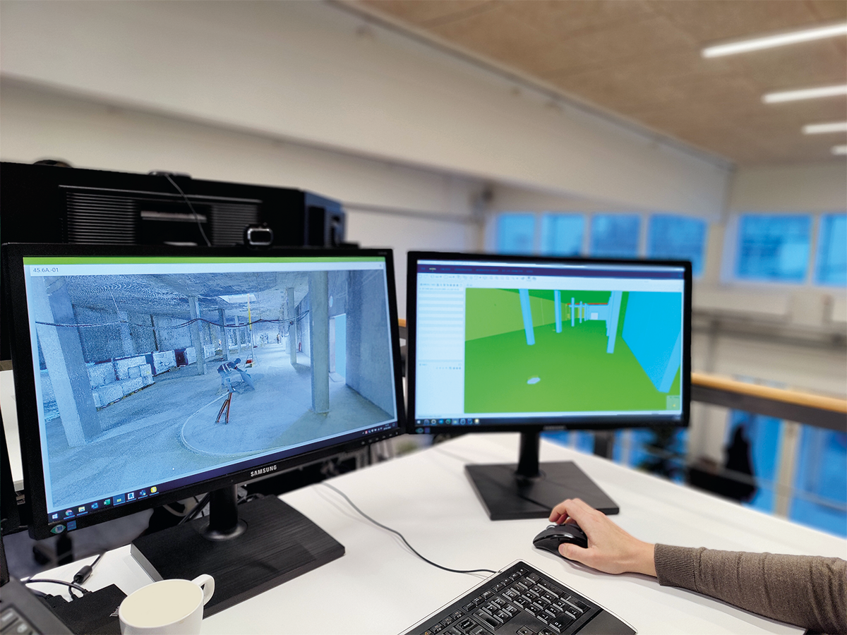 Computerskærme med 3D-modellering af et byggeri